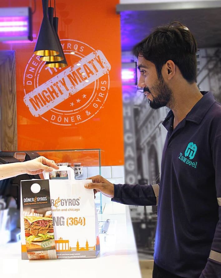 Tawseel rider collecting an order at Mighty Meat